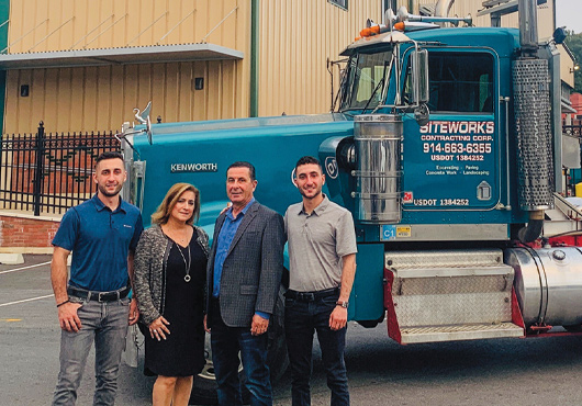 The founders of Siteworks Contracting Corp., President Patricia Rossi and Executive Project Manager Artie Rossi (center, left to right), with Project Manager Michael Rossi (left) and Junior Estimator Matthew Rossi.