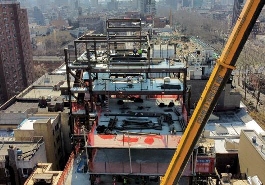 Mark & Son Metal Products, Inc. puts the roof on a 10-story building at 139 East Houston St. in Manhattan. The project required 1,000 tons of steel and illustrates the firm’s increased capacity.