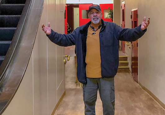 Paul Diaz, project manager and estimator for ABC Interiors Unlimited, Inc., celebrates completion of a project at Canaan Baptist Church of Christ in New York City.