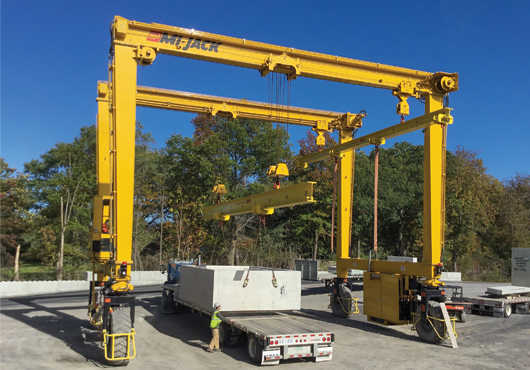 LHV Precast Inc.’s Kyle Willis operating a 50-ton Mi-Jack mobile crane, while brother Dylan steadies box culvert. This piece of equipment has proven to be extremely useful, safe and efficient on many of the company’s complex jobs. 