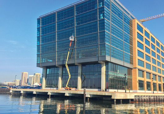Skyreach Equipment, Inc.’s atrium crawler is all that’s needed to access a broken window on T. Rowe Price’s building in Baltimore, MD.