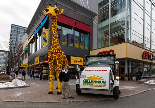 Much of Millennium Maintenance & Power Sweeping’s work involves keeping passageways safe for vehicles and pedestrians. At the entrance to LEGOLAND Discovery Center at Federal Realty’s Assembly Row in Somerville, Massachusetts, it also means carefully removing debris or snow and ice around Gio, the familiar Lego giraffe.
