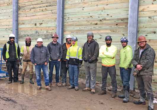 A portion of the Sea & Shore Contracting, Inc. team on the job site of a noise and screening barrier wall project for a high-tech company in Waltham, Massachusetts.