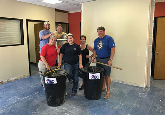 ABC of the Carolinas staffers Michelle Lewter, Chris Bullard, Jeff Morris, Brittany Hyder, April Frye and Doug Carlson (former CEO) demo the building on the new 10,000-square-foot Triangle Training Center before it gets a makeover.