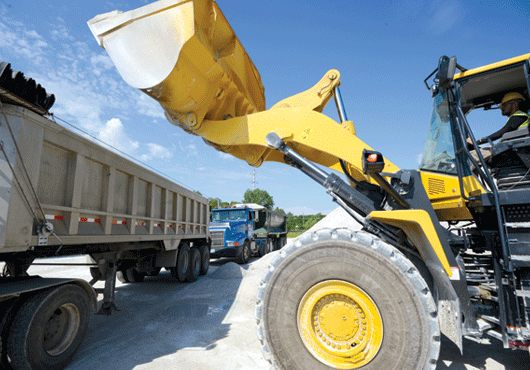 An AMS team member at work in the material yard.
