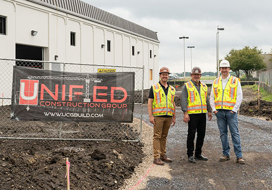 Nathan Ries (left) serves as President of Unified Construction Group, LLC, with Noel Valenti (center) as Senior Vice President and Erik Bolsinger as Vice President of Operations.