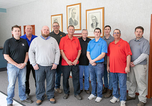 The Sundeen family employees with owner David Sundeen (clad in a red shirt) standing in the center. After five generations in business, an enhanced level of respect for people continues to fuel the culture at Sun Ray Heating, Inc.