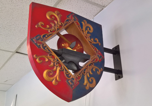 One of the first signs that Ben Kitzler made for the company is this intricate pattern that currently hangs over his father’s blacksmith shop.