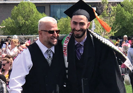 Khaled Hamideh (left) and son Waleed, a part-owner of Flag World Company, at Waleed’s college graduation.