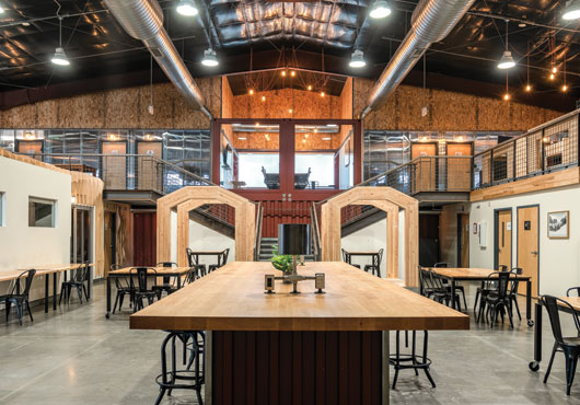A variety of conference tables in the common areas give multiple teams room to share projects, plans or a cup of joe.