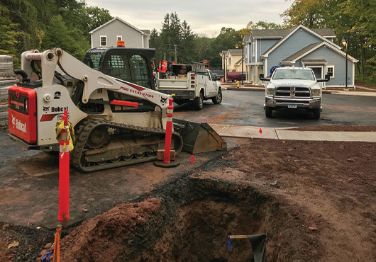 Pro Excavation LLC prepares a site for underground utility installation in a multifamily subdivision.