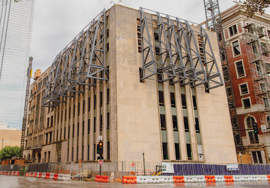 An exterior view of the southwest side of The Records Building Annex (built in 1955). The intricate steel braces anchored from the fourth floor to the roof are temporarily supporting the building’s structure.