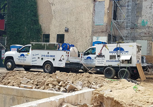 One of the Concrete Cutting Systems Inc.’s service trucks on a job site with a generator supplying power for wall and wire sawing. 