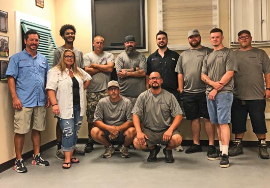 The close-knit team at Houston Hurricane & Security Products, which Owner Frank Mistretta says is like a family.