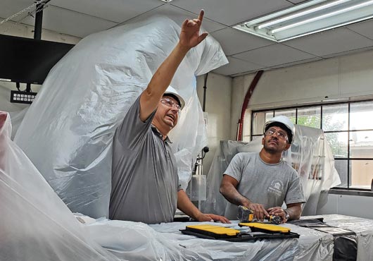 Owner Elias Garcia (left) and Foreman Wilson Galo discuss details of the Sonic Drive-In project in Richmond, TX. 