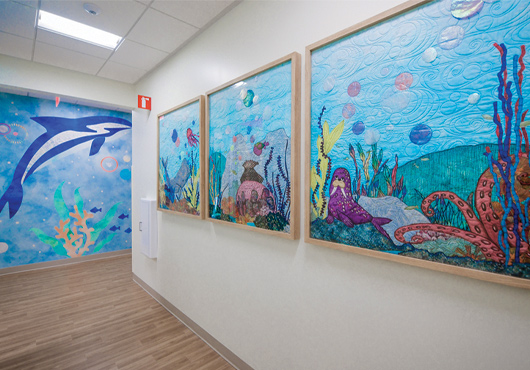 The Thompson Autism Center is an upfit of a 20,000-square-foot shell building. Colorful, soothing murals are an important part of the design.
