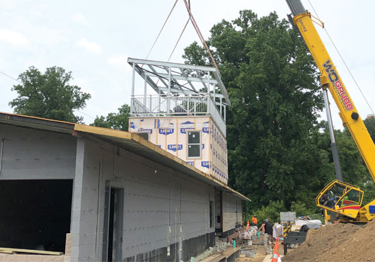 The press box installed by Grandstand Design Enterprises, Inc. at the Towson University Soccer Complex features an enclosed broadcast booth and an open-air rooftop gallery. 