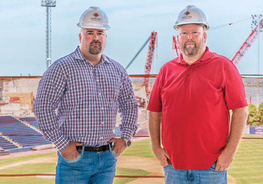 Anthony Santiago (left) and Jeff Anderson on site at one of their most notable assignments, the Empire Outlets project, in Staten Island.