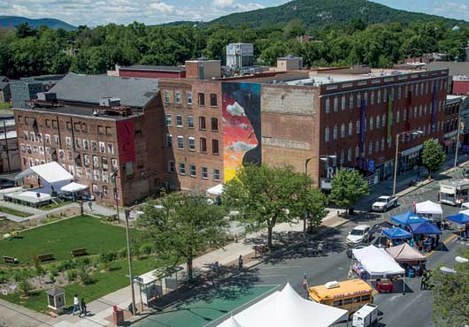 Safe Harbors of the Hudson is housed in the 116,000-square-foot complex in the city of Newburgh, N.Y. The complex includes the Safe Harbors Green and Safe Harbors Ritz Theater on the left, the Safe Harbors Cornerstone Residence on the top floors to the right, commercial space on the first floor as well as the Lobby at the Ritz and the Safe Harbors Ann Street Gallery.