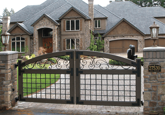 The look of this stately home is enhanced by a bold gate design.