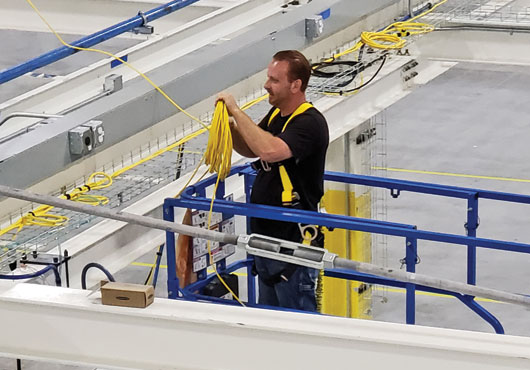 Thunder Valley Enterprise professionals install structured wiring for industrial controls of an assembly line.