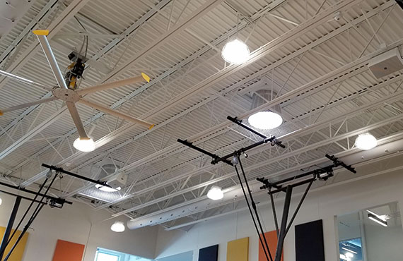 Solatubes provide consistent natural lighting throughout the day inside an elementary school gymnasium.