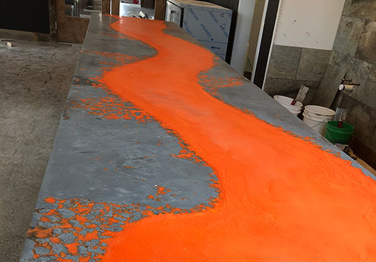 Pro Concrete Countertops LLC Owner Dian Mullis got creative and bold with this countertop made to resemble flowing lava for a Hawaiian pizza restaurant.