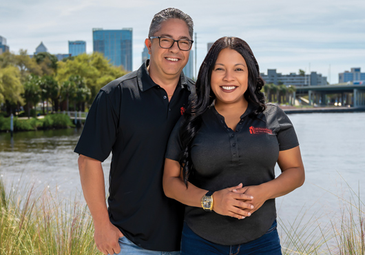 For Cynthia Santa, devising great solutions for clients is always a team effort! She is shown here with Operations Coordinator Jorge E. Hernandez, who helps to build camaraderie and trust among the staff.