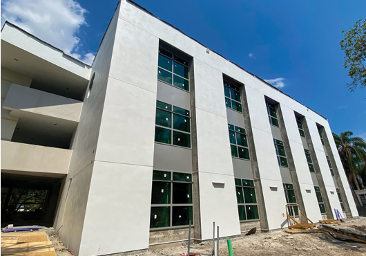 The University of Miami’s student services center features stucco and EIFS exterior cladding provided by CRS Restorations, LLC. LPC Scaffold Services, Inc. also pitched in by engineering large, elevated “dance floor” work platforms to enhance safety for installation crews.