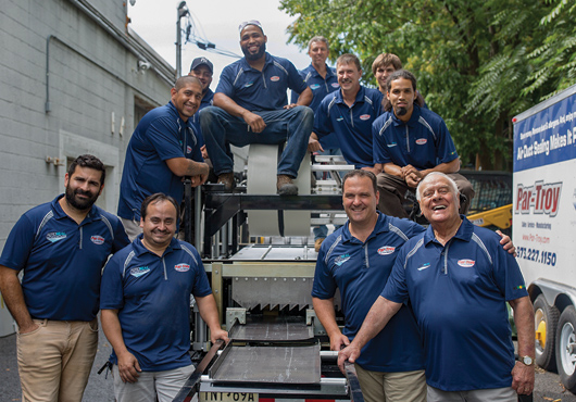 Members of the Par-Troy Sheet Metal & Air Conditioning LLC team outside their shop in Fairfield, New Jersey.