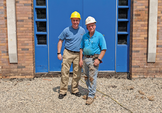 Ira (right) and Brian Goldberg, the father-and-son team that run Beyond Concrete, at a job site in New York City.