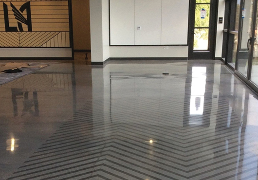 Pacific Decorative Concrete, Inc. created a specialized stencil, overlay and polished floor finish for the Los Angeles Football Club’s newly constructed training facility. The distinctive chevron design was specified by the project architect.