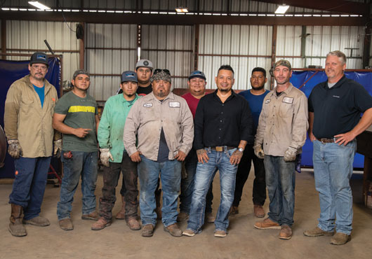 This team, along with Manager Chuck Ogle (far right), represents a combined 80 years of experience in structural steel fabrication.