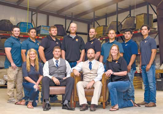 David Harris, CEO and President of Riverbed Concrete, Inc. (front, second from left), credits the company’s success to its people, products and processes. 