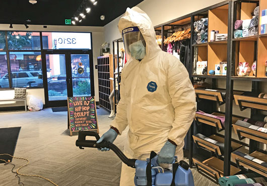 Dwain Marshall, Partner at Umoveit-Wecleanit Commercial Janitorial, Inc., fogs a retail store. The company has four fogging machines used to disinfect for COVID-19. 