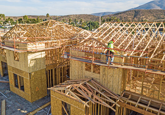 A home in the Sweetwater Place community in Spring Valley, CA, is treated to fascia work by a Six Star Framing Concepts crewman. The company framed 122 two-story homes there in 12 months.