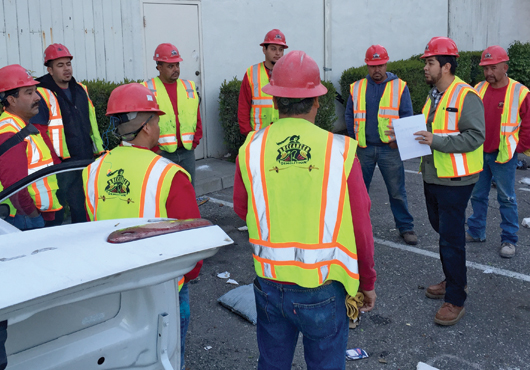 Jose Uribe reviews the day’s activities with his team. Each Buccaneer Demolition professional follows a checklist of specific procedures and a site hazard analysis to complete work safely.