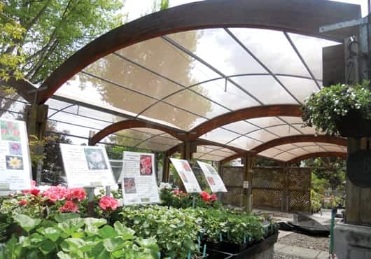Mesh shade cover arrays at a nursery in Berkeley, Calif.