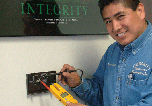 Carlos Ramiro of ICM tests an electrical system.