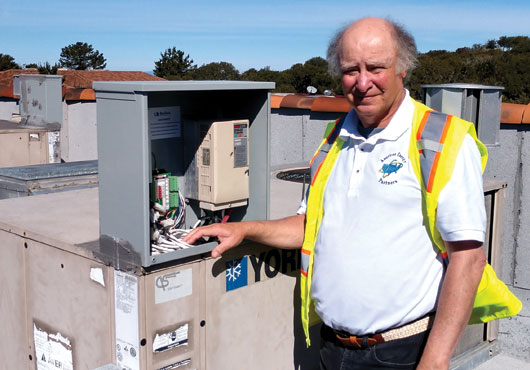 Robert Finn, Owner and President, stands by the controller for the variable-frequency drive installed by American Energy Partners Inc. at Monterey Bay Endoscopy Center.