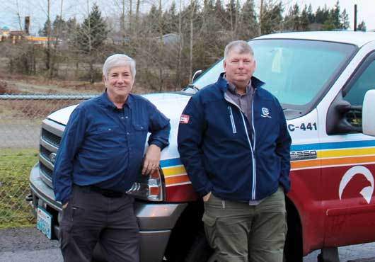 Standing on the left is Vice President of Northwest Cascade Inc. and General Manager of Honey Bucket, Ron Inman, with Vice President of FloHawks, J.R. Inman.