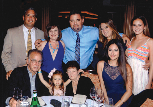 The Delgado and Mirabent families at a Rock Power Paving, Inc. Christmas party. 